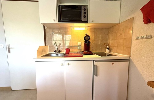 Praz-sur-Arly Apartment | Cozy Ski-In/Ski-Out Apartment in Praz Sur Arly for 4 with Balcony, Parking, and Ski Locker
