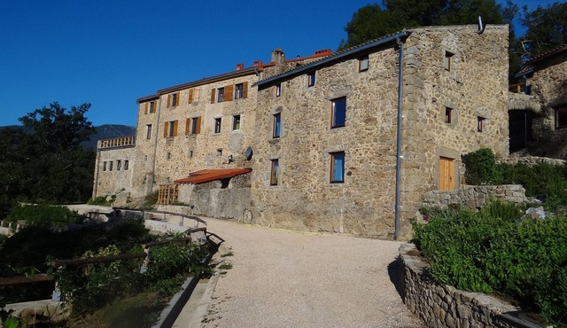 Mas Vilalte, an old mansion house immersed in the woody slopes of Mount Canigo